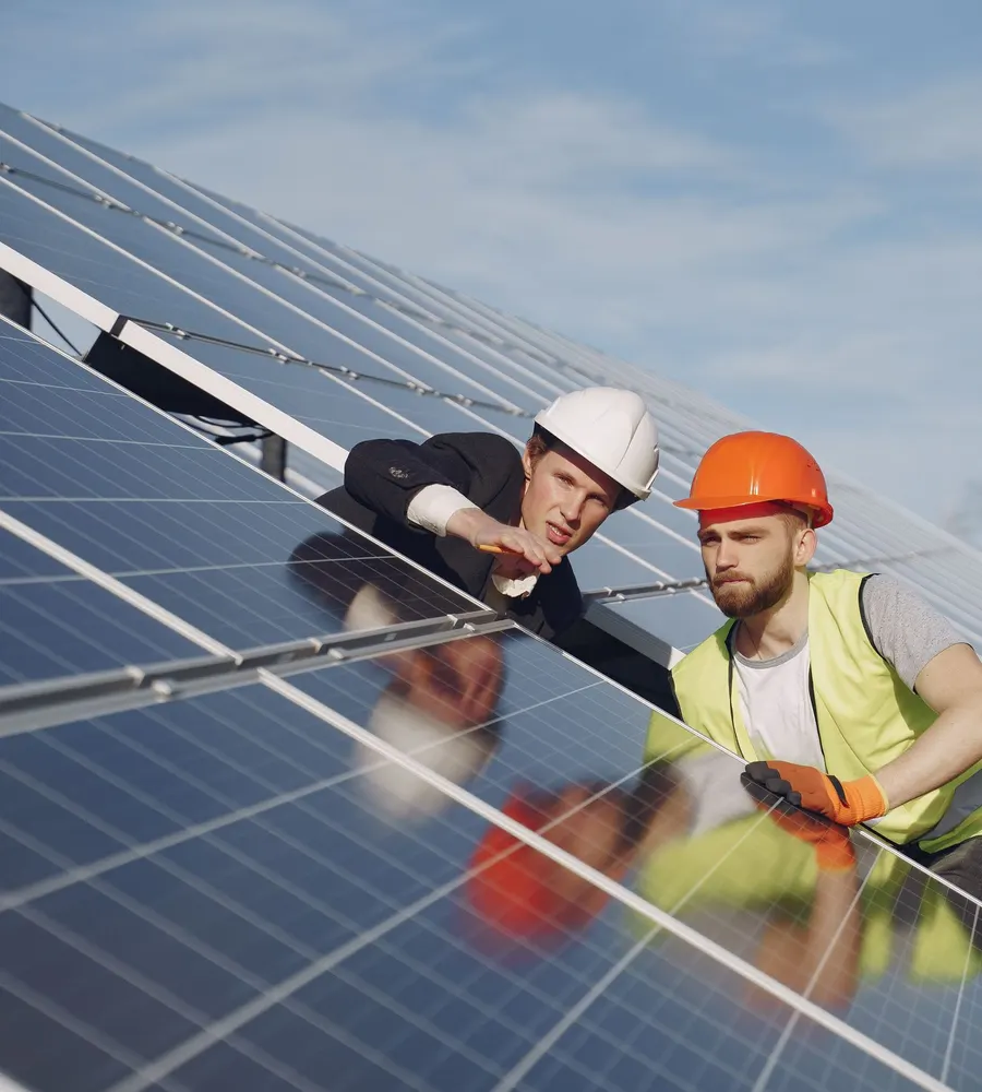 Technicians installing solar panels