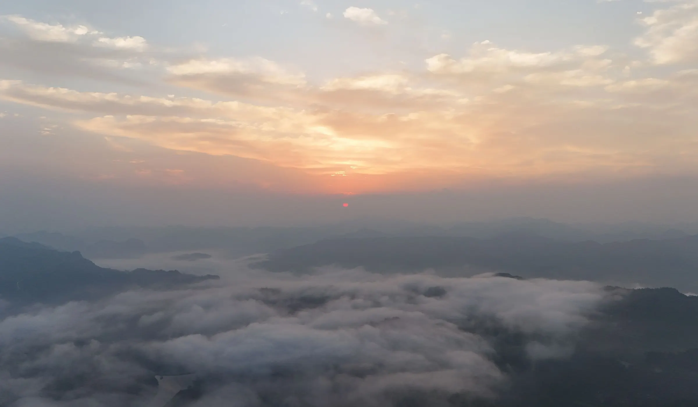 Mountain ridges rising out of morning mist at sunrise